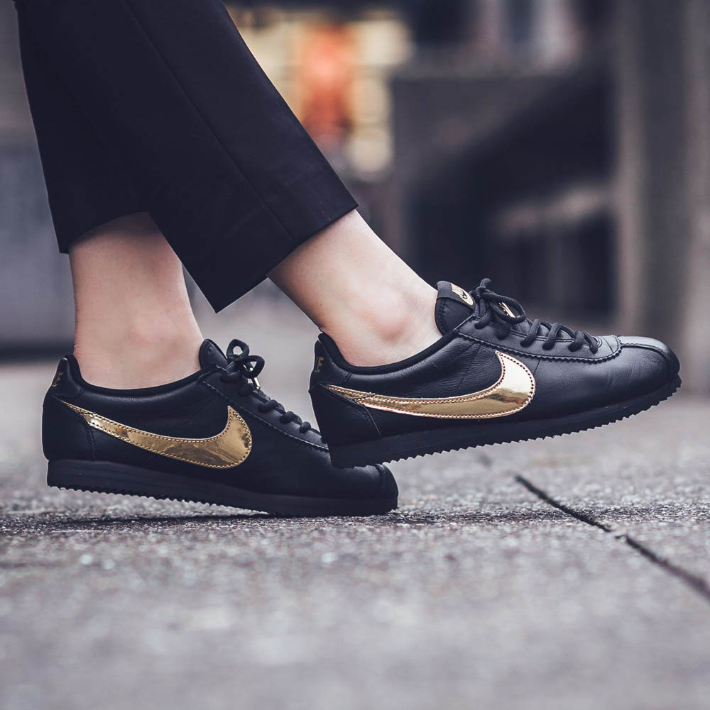 nike cortez trainers in black and rose gold