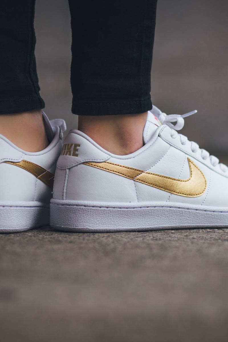 white nike shoes with gold